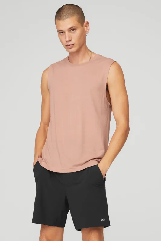 The Triumph Muscle Tank - Soft Clay sold by Alo Yoga