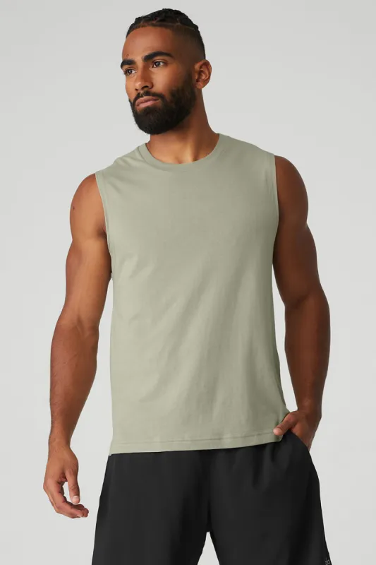 The Triumph Muscle Tank - Limestone sold by Alo Yoga