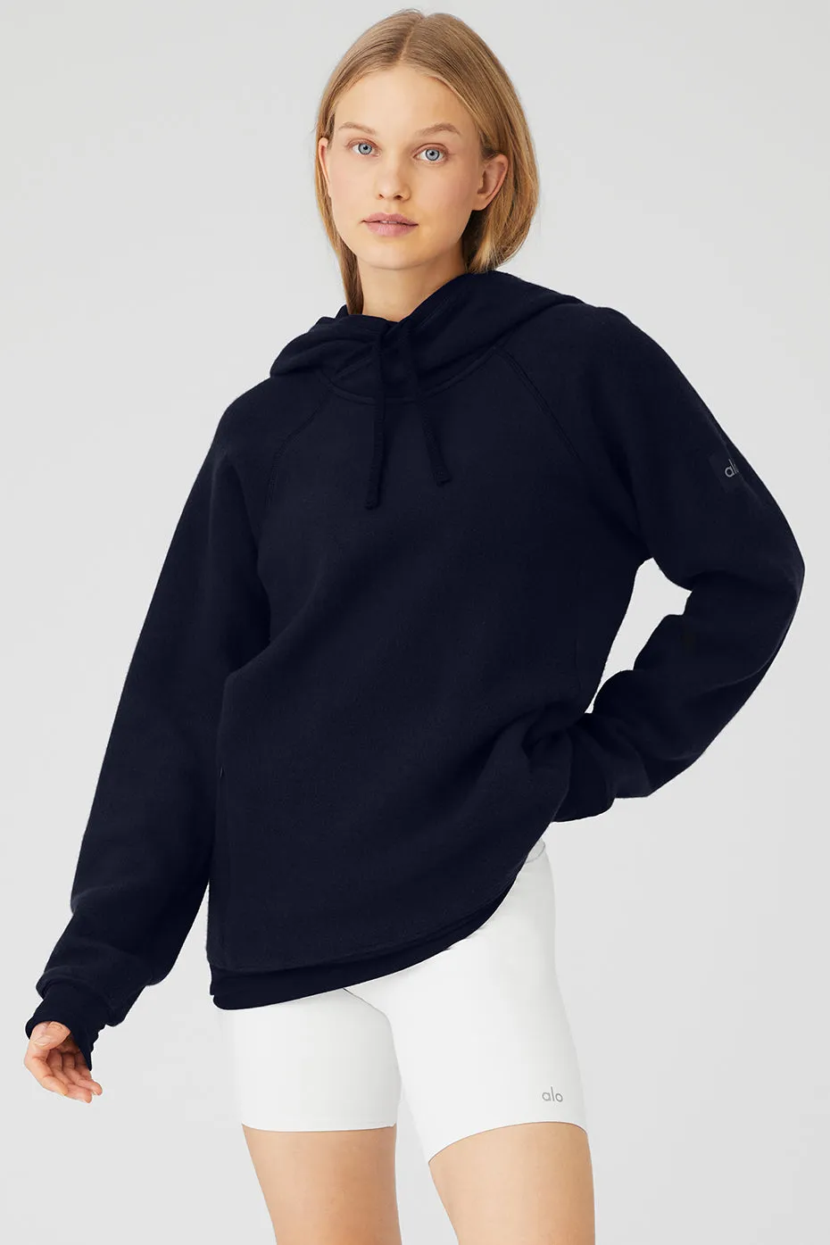 The Triumph Hoodie - Navy sold by Alo Yoga