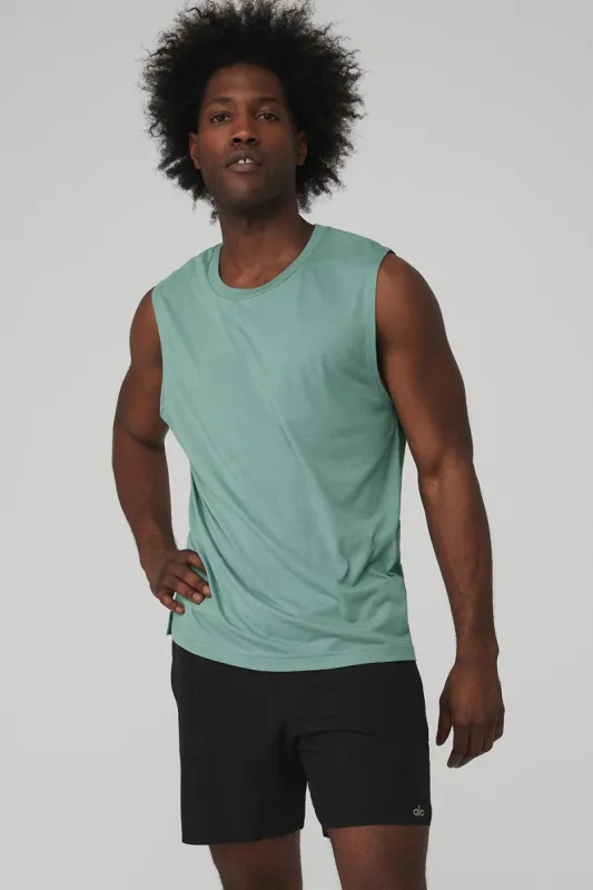 The Triumph Muscle Tank - Blue Agave sold by Alo Yoga