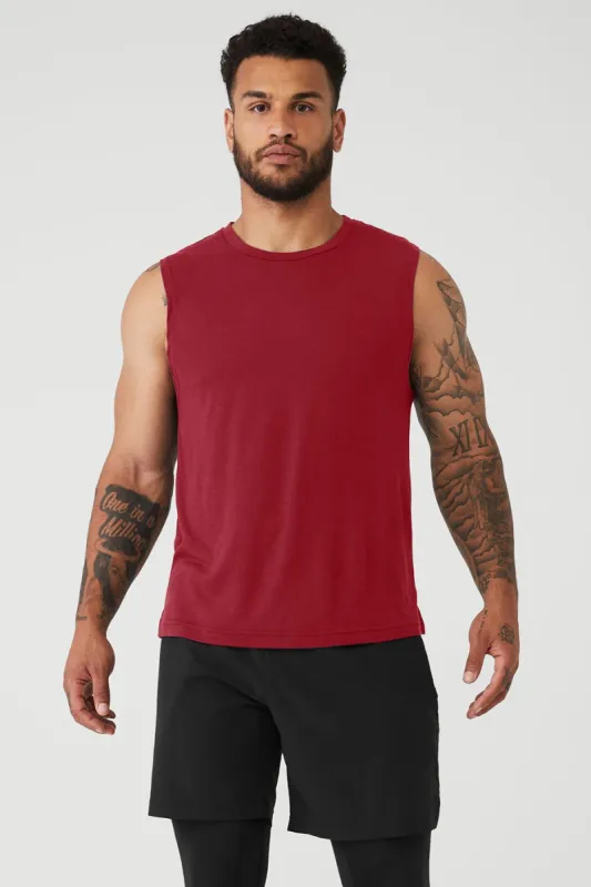 The Triumph Muscle Tank - Victory Red sold by Alo Yoga