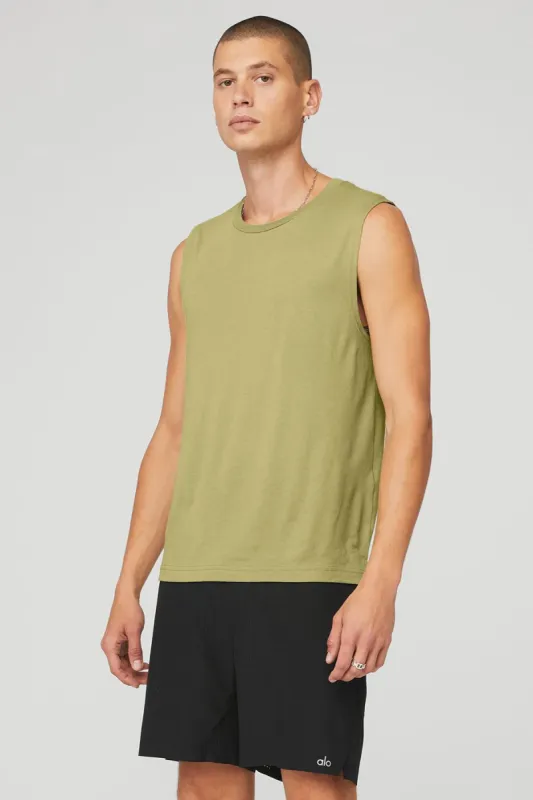 The Triumph Muscle Tank - Wasabi sold by Alo Yoga