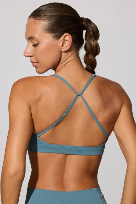 Evolve - Multiway Twist Front Sports Bra in Slate Blue sold by Bo + Tee
