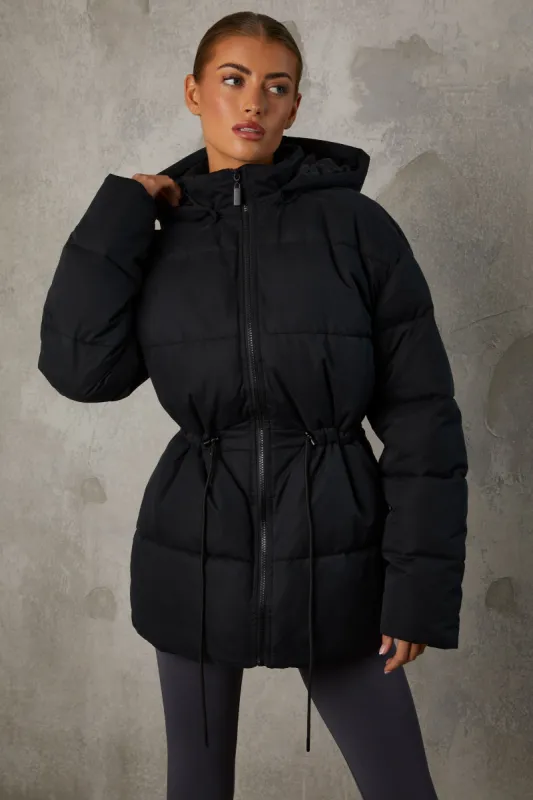 Snug - Mid Length Hooded Puffer Coat in Black sold by Bo + Tee