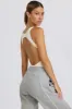 Soft Active Open-Back Bodysuit in White sold by Bo + Tee