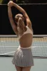 Soft Active Open-Back Bodysuit in White sold by Bo + Tee