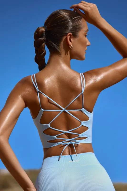 Accomplish - Plunge Neck Open Back FlexiRib Sports Bra in Sky Blue sold by Bo + Tee