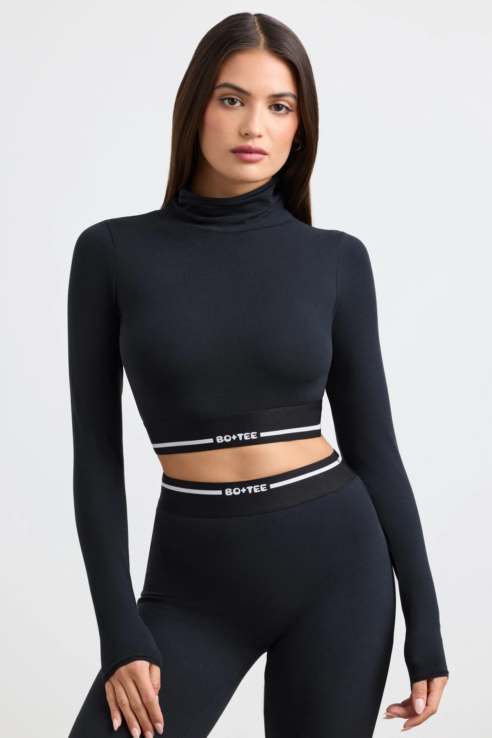 Backless Turtleneck Long-Sleeve Crop Top in Black sold by Bo + Tee
