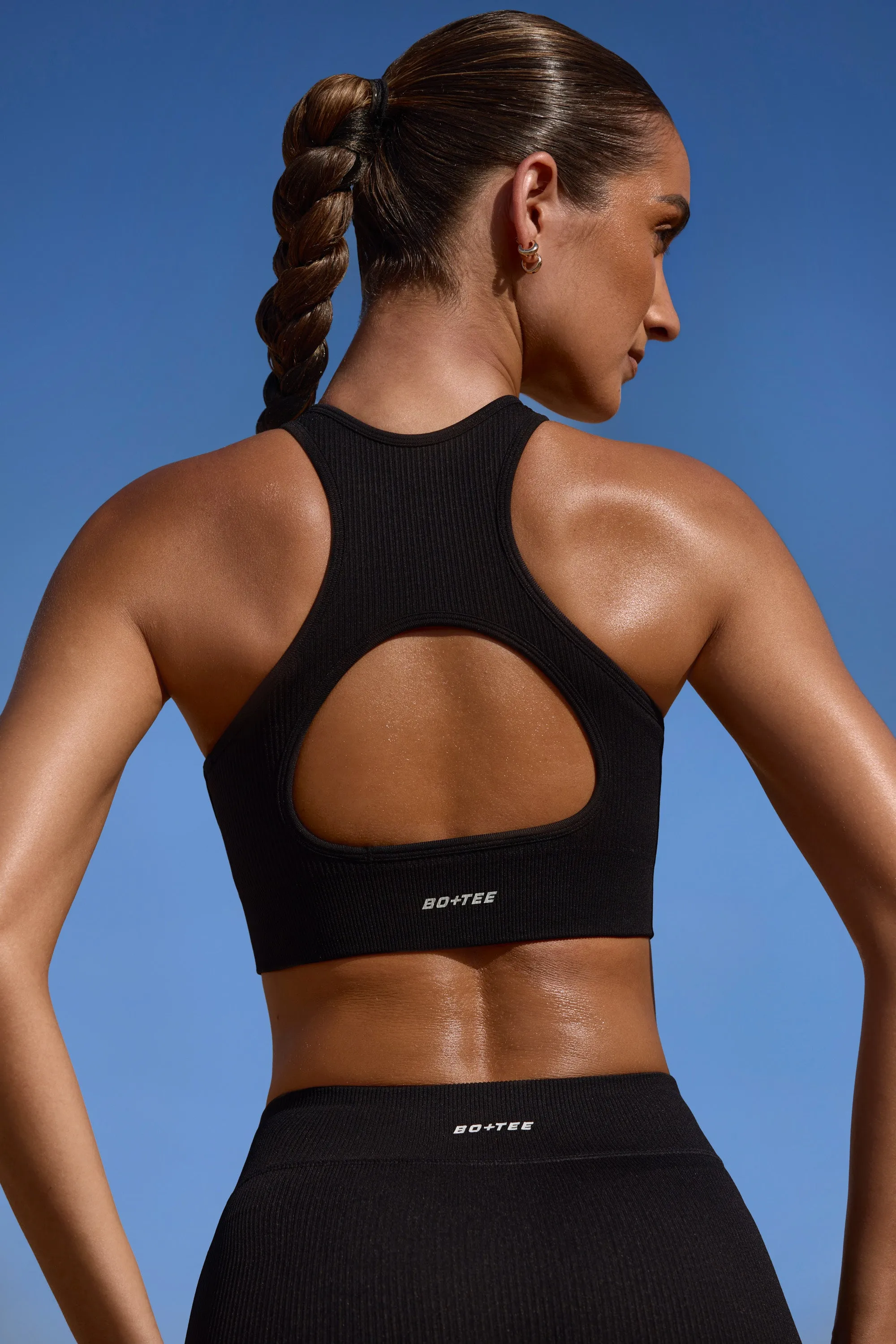 Success - High Neck Open Back FlexiRib Sports Bra in Black sold by Bo + Tee