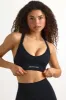 Super Sculpt Seamless Cross-Back Sports Bra in Black sold by Bo + Tee