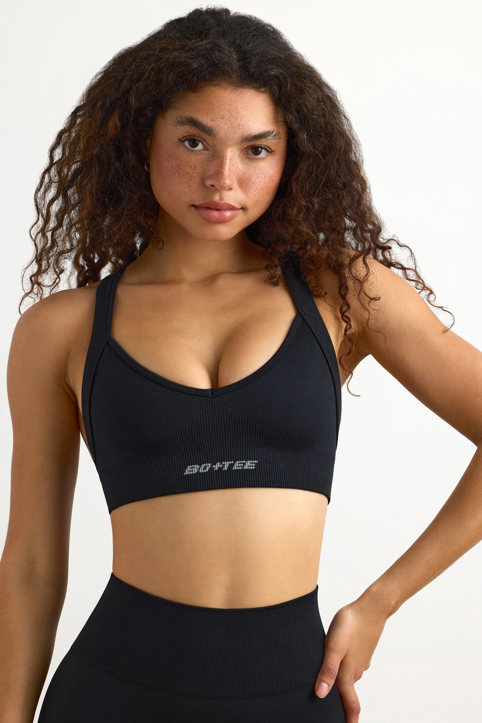 Super Sculpt Seamless Cross-Back Sports Bra in Black sold by Bo + Tee product image thumbnail 4