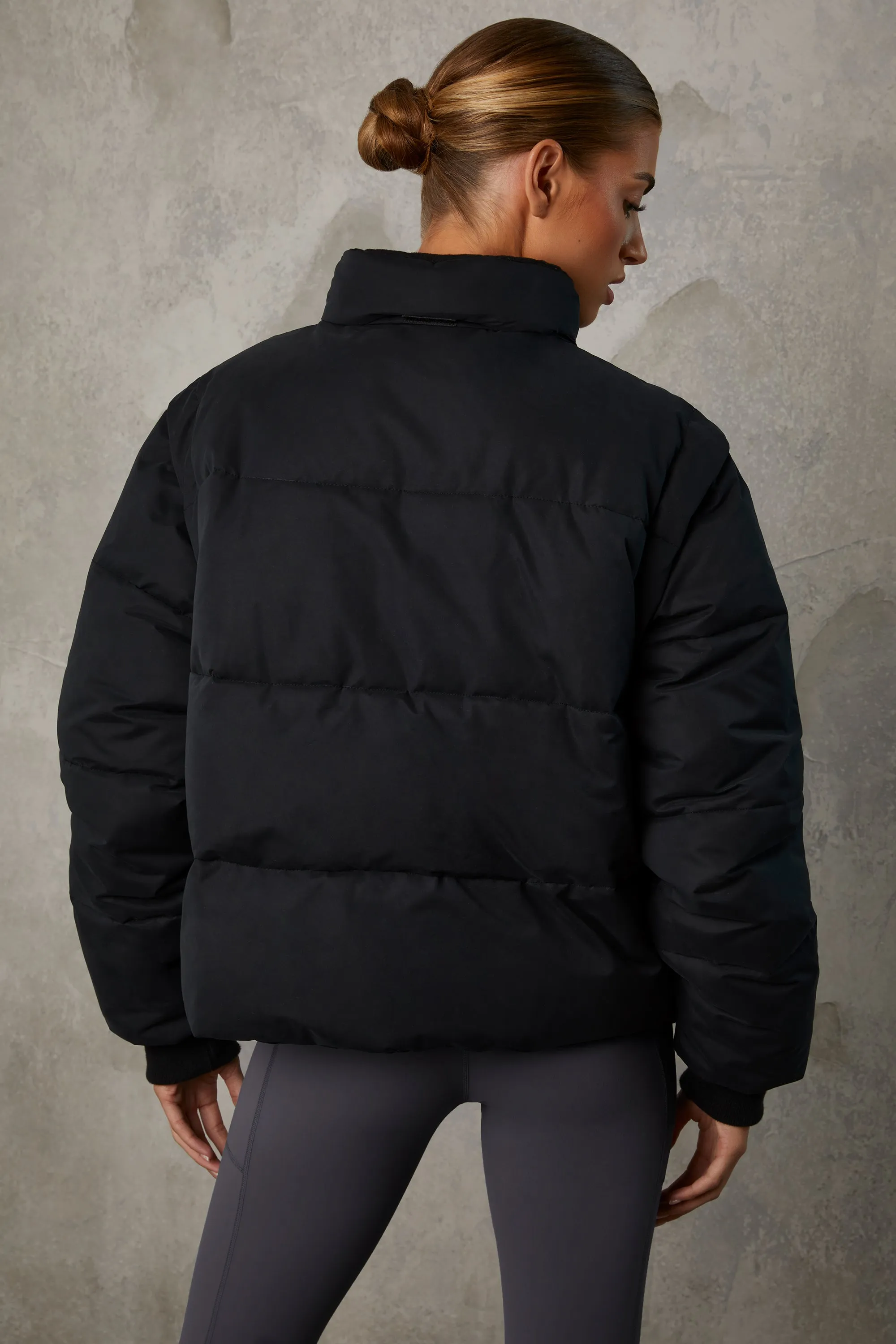 Cropped Puffer Jacket with Detachable Sleeves in Black sold by Bo + Tee product image thumbnail 4