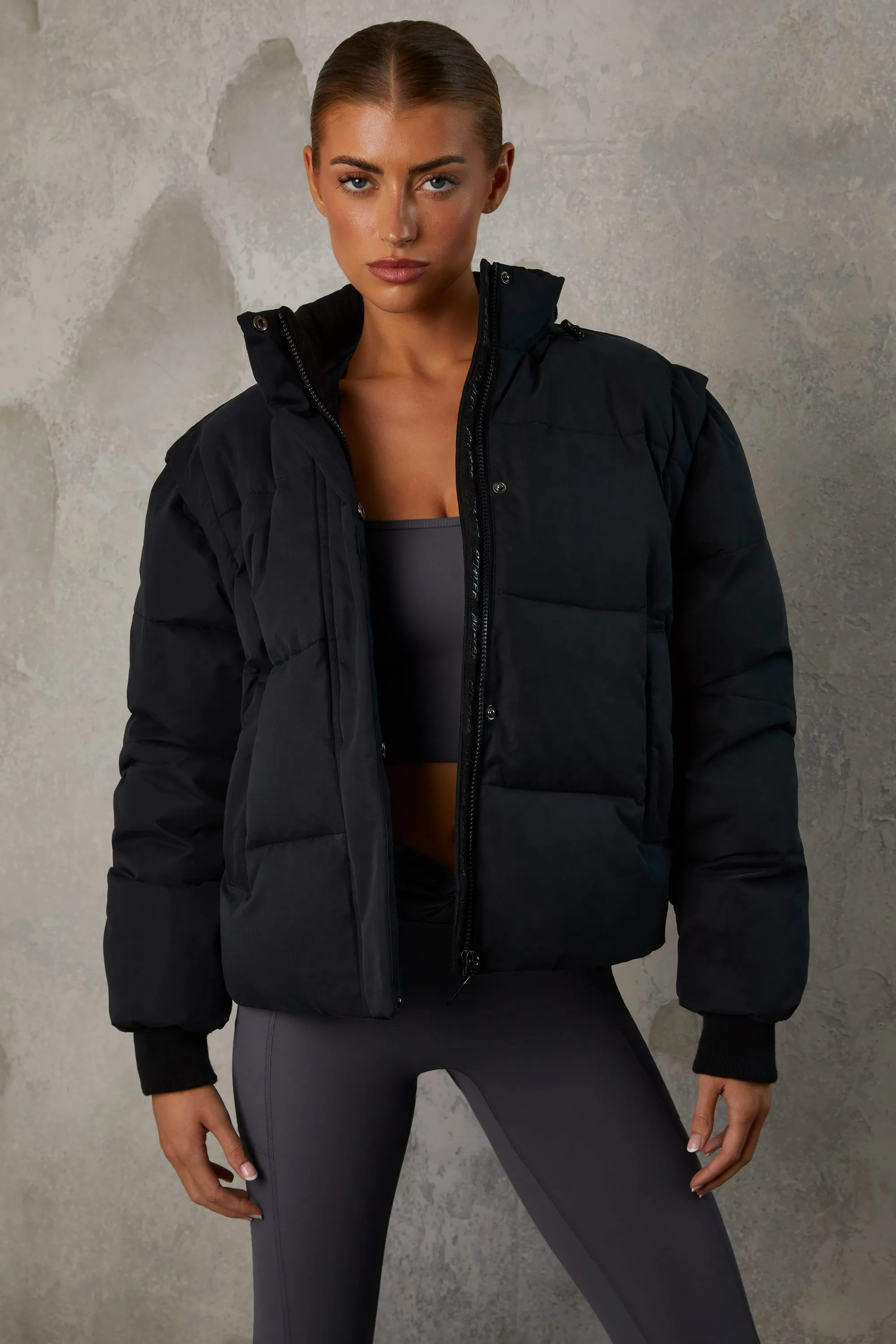Cropped Puffer Jacket with Detachable Sleeves in Black sold by Bo + Tee product image thumbnail 5