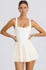 Soft Active Open-Back Pleated Tennis Dress in White sold by Bo + Tee