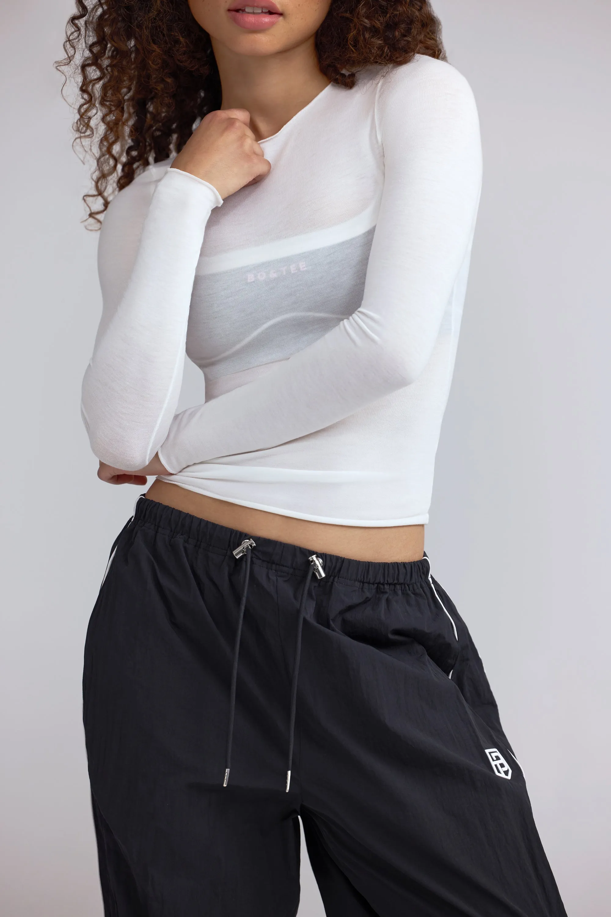 Sheer Long-Sleeve Top in White sold by Bo + Tee