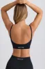 Super Sculpt Seamless Scoop-Back Sports Bra in Black sold by Bo + Tee