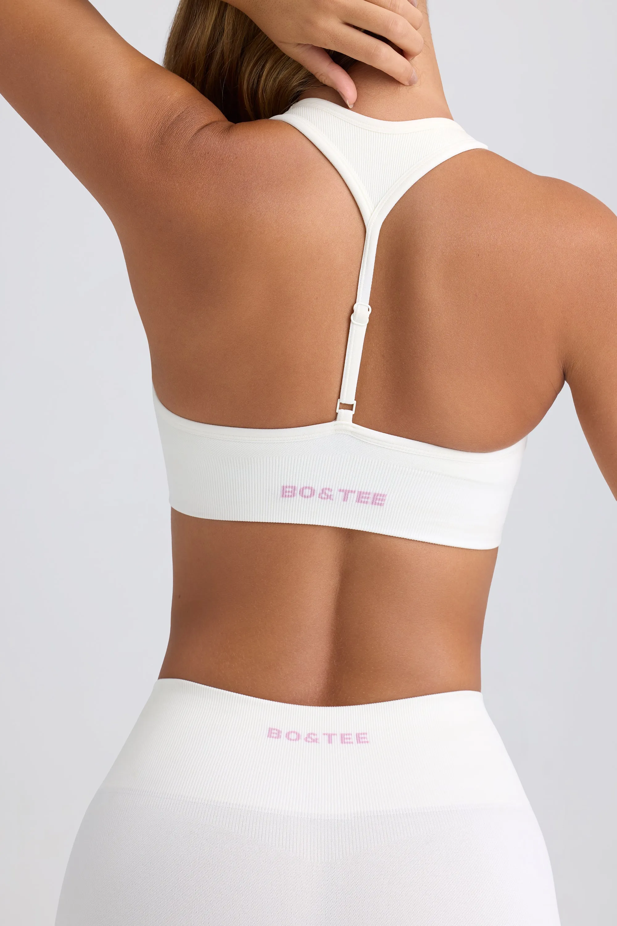 Super Sculpt Seamless T-Back Sports Bra in Eggshell sold by Bo + Tee