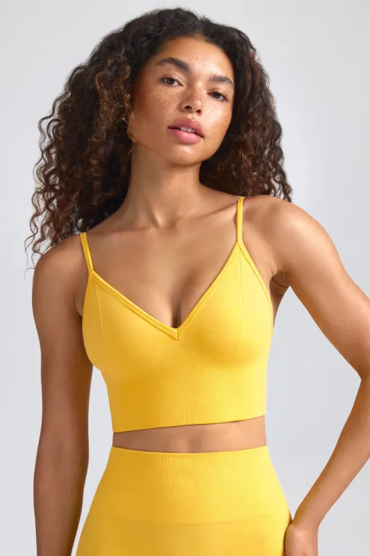 Define Luxe V-Neck Sports Bra in Golden Yellow sold by Bo + Tee