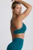 Super Sculpt Seamless Cross-Back Sports Bra in Teal sold by Bo + Tee