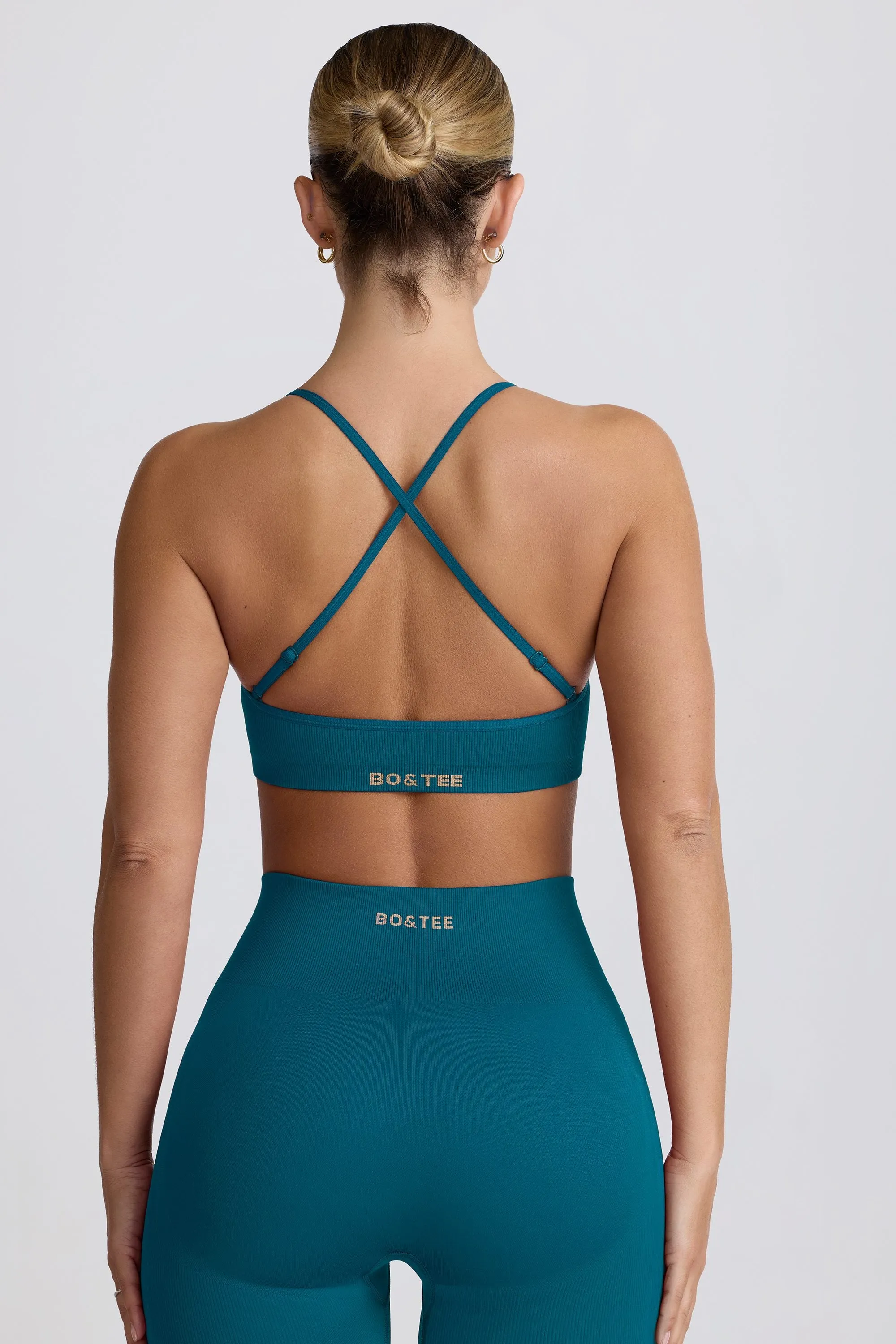 Super Sculpt Seamless Cross-Back Sports Bra in Teal sold by Bo + Tee product image thumbnail 3