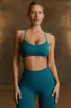 Super Sculpt Seamless Cross-Back Sports Bra in Teal sold by Bo + Tee