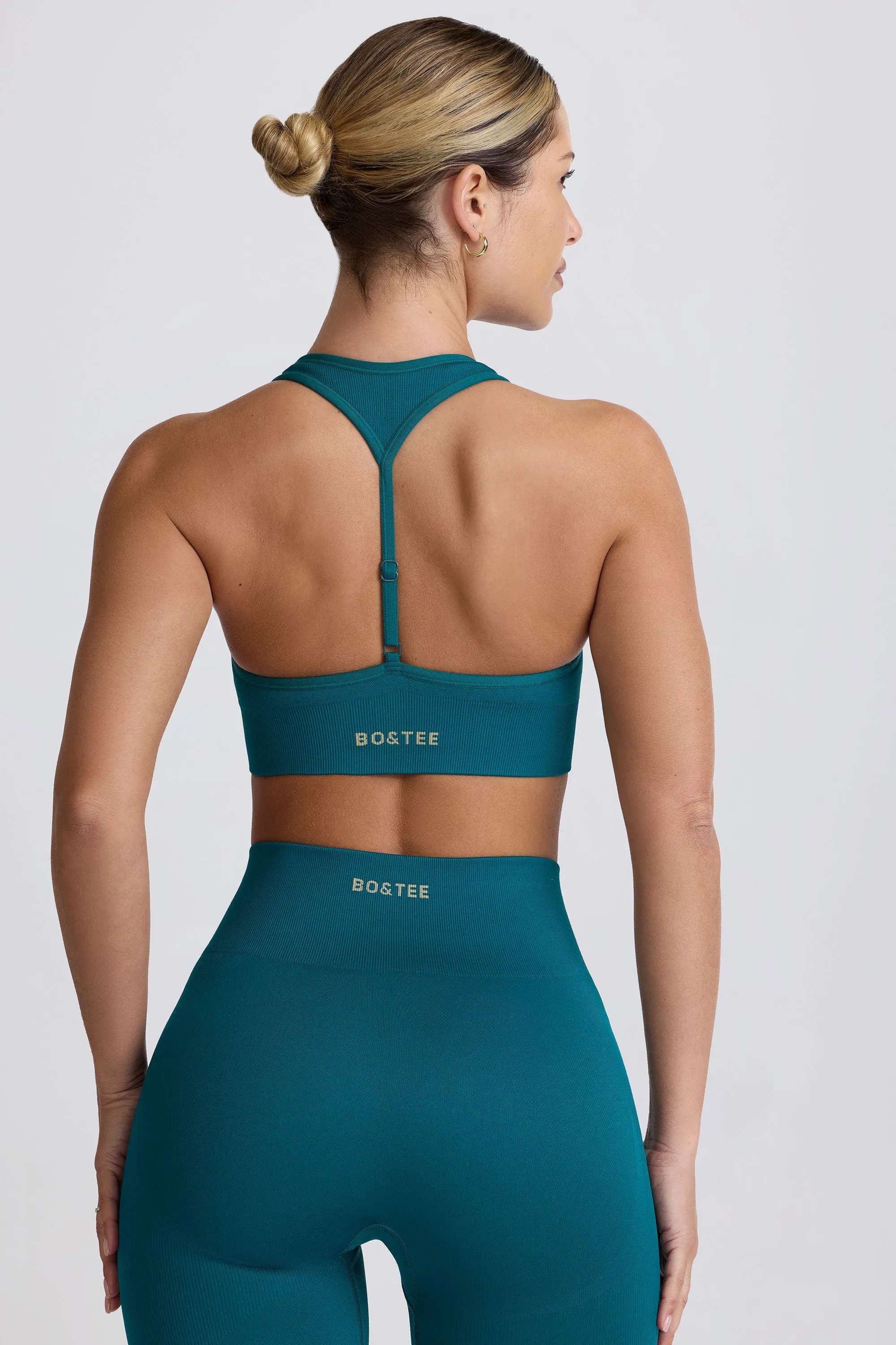 Super Sculpt Seamless T-Back Sports Bra in Teal sold by Bo + Tee