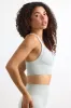 Super Sculpt Seamless Cross-Back Sports Bra in Fog sold by Bo + Tee