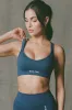 Super Sculpt Seamless Cross-Back Sports Bra in Blue sold by Bo + Tee