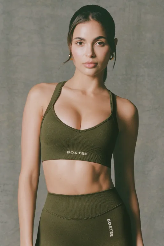 Super Sculpt Seamless Cross-Back Sports Bra in Dark Green sold by Bo + Tee