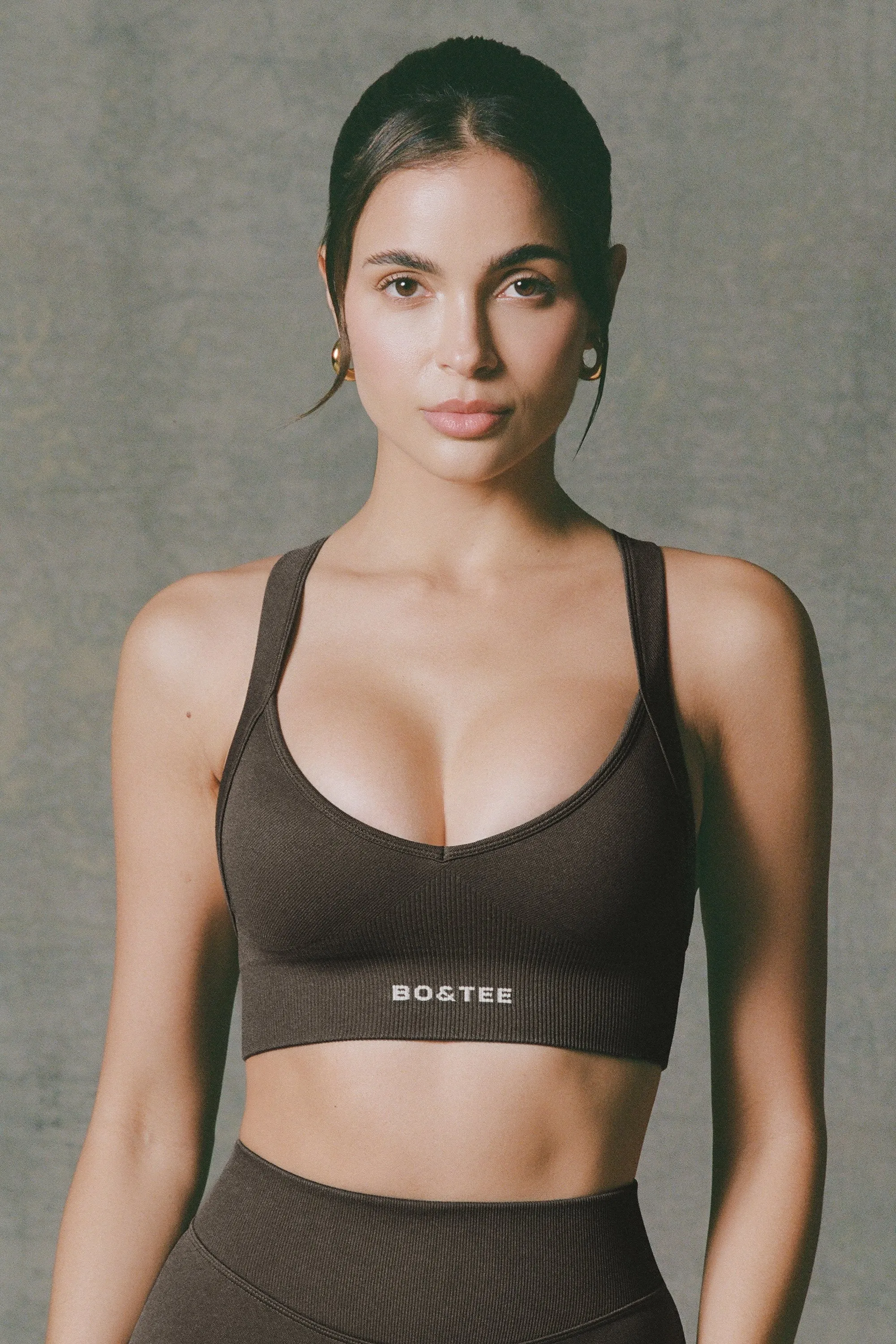 Super Sculpt Seamless Cross-Back Sports Bra in Brown sold by Bo + Tee