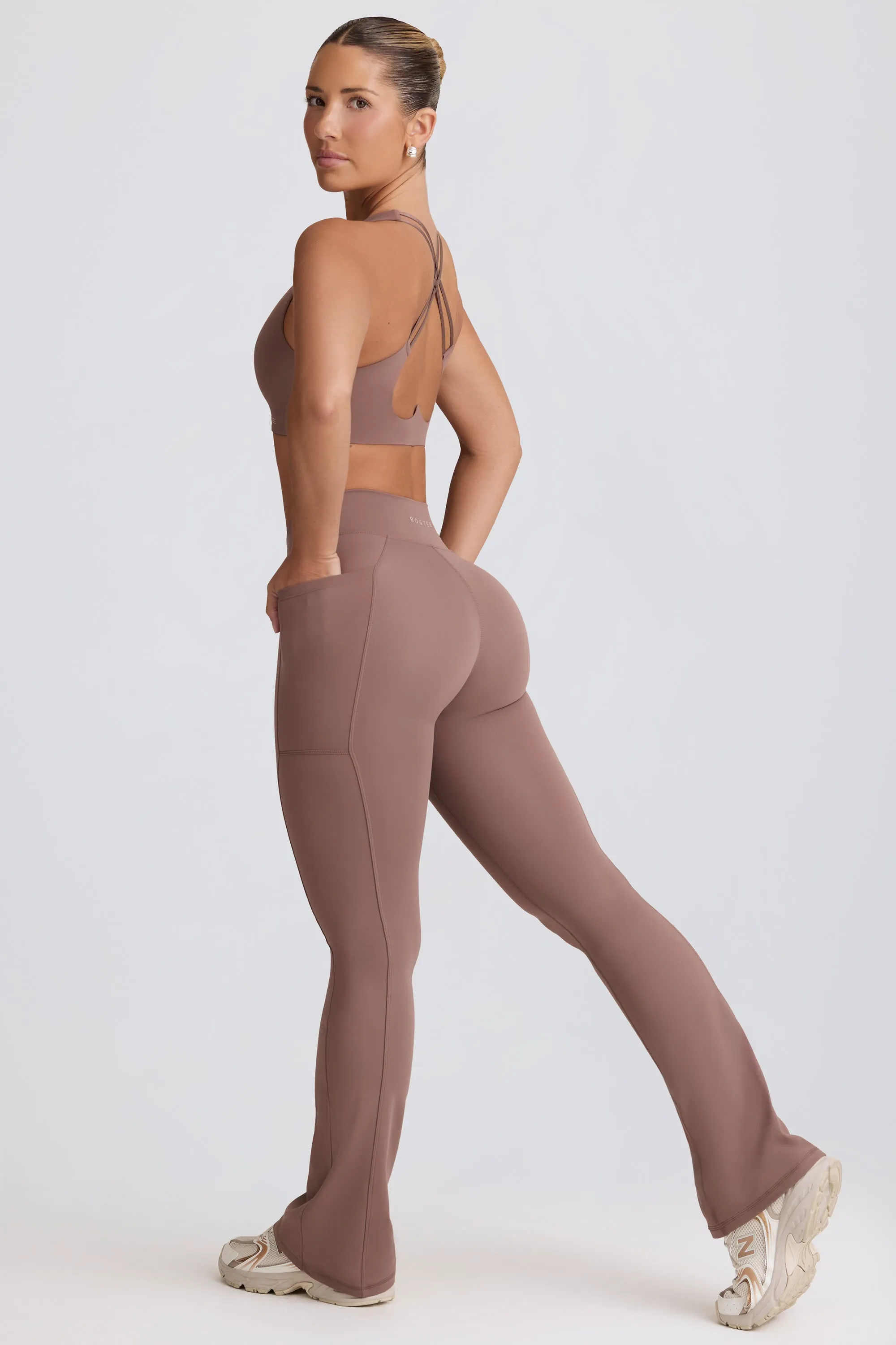 Soft Active V-Waist Pocket Flared Leggings in Mocha sold by Bo + Tee