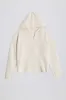 Ribbed-Knit Oversized Hoodie in Ivory sold by Bo + Tee