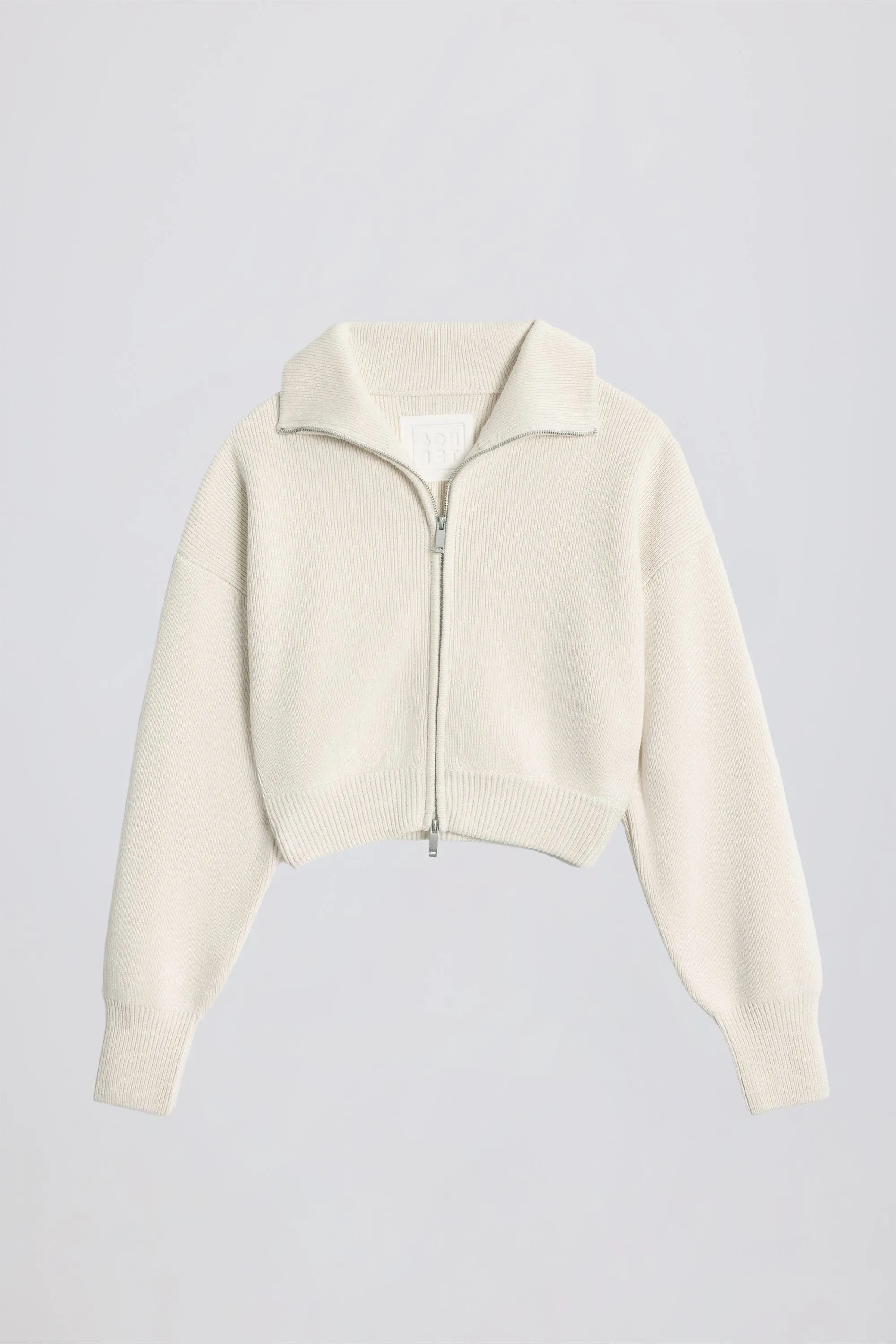 Ribbed Knit Zip-Up Cropped Sweatshirt in Ivory sold by Bo + Tee