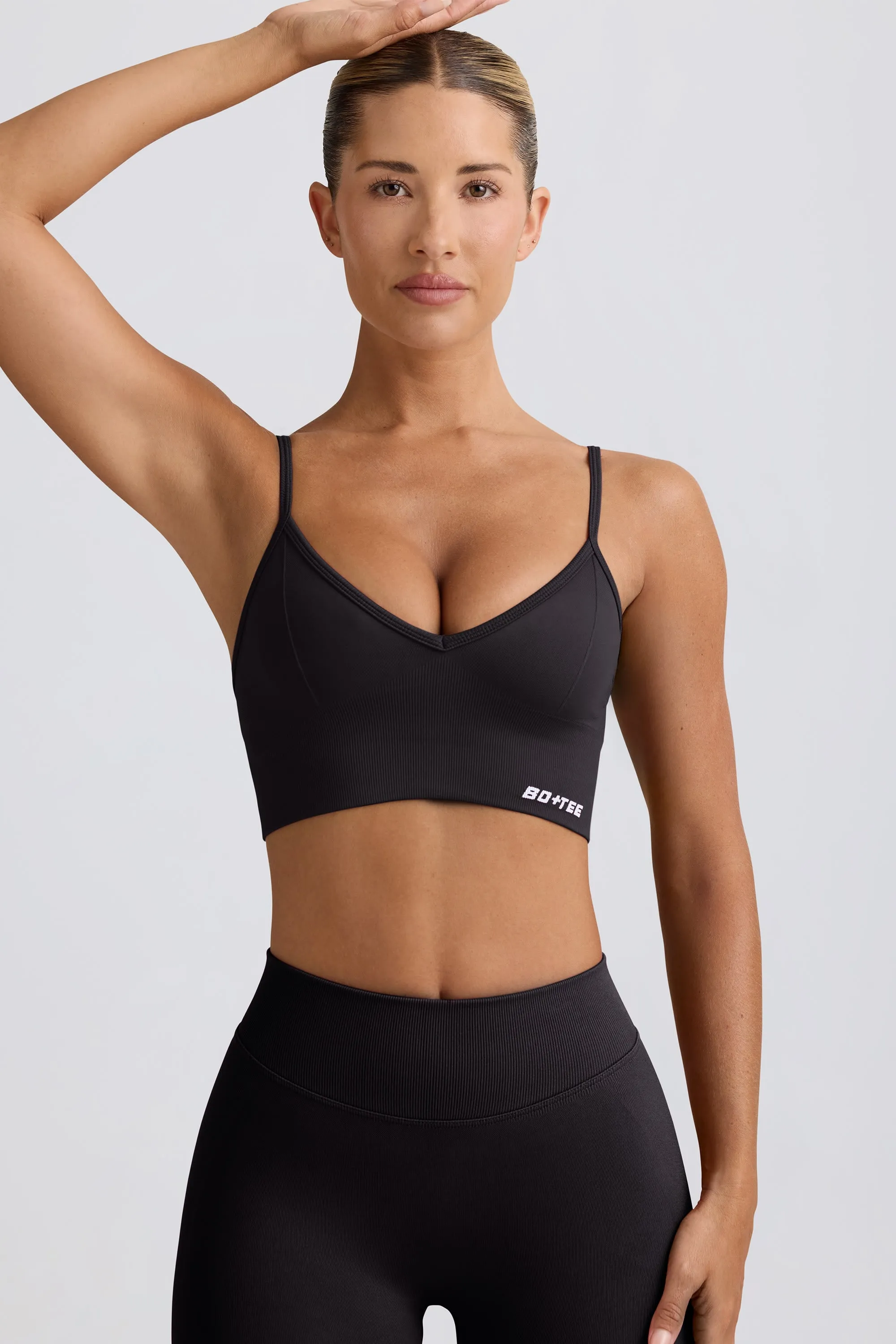 Define Luxe V-Neck Sports Bra in Black sold by Bo + Tee