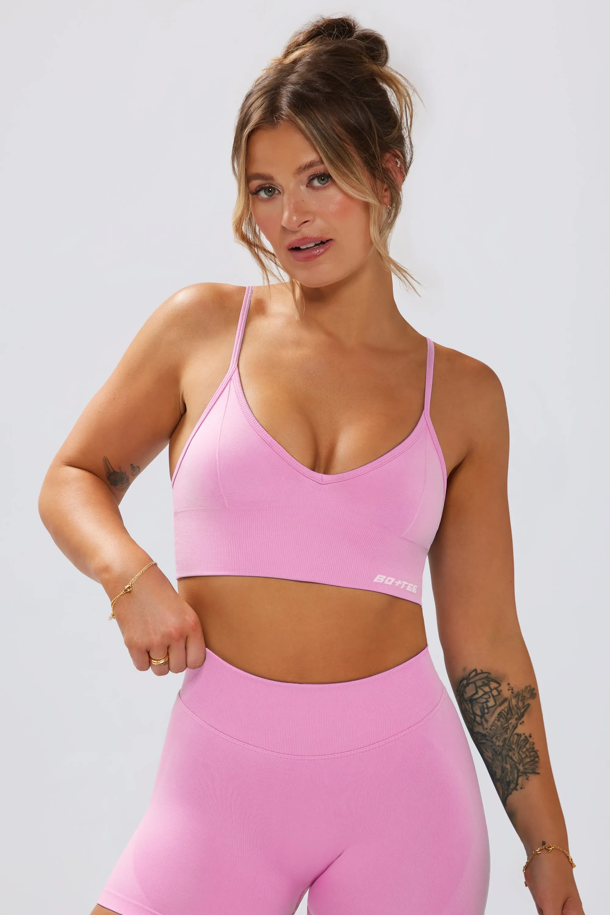 Define Luxe V-Neck Sports Bra in Bubblegum Pink sold by Bo + Tee