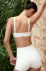 Soft Active Contrast-Trim Sports Bra in Cream sold by Bo + Tee