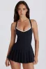 Soft Active Cross-Back Pleated Tennis Dress in Black sold by Bo + Tee