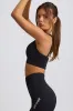 Super Sculpt Seamless Cross-Back Sports Bra in Black sold by Bo + Tee