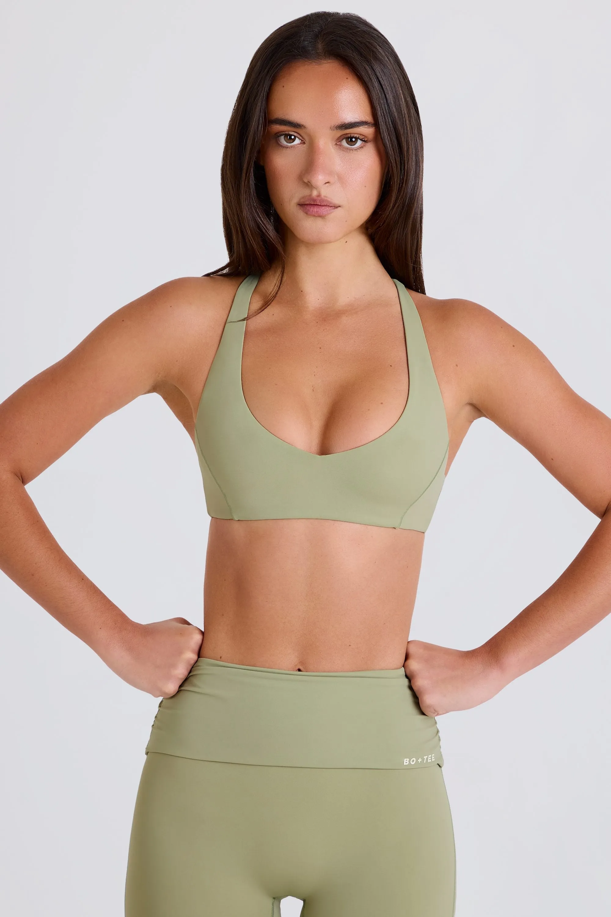 Four-Way Stretch Crossback V-Neck Sports Bra in Matcha sold by Bo + Tee