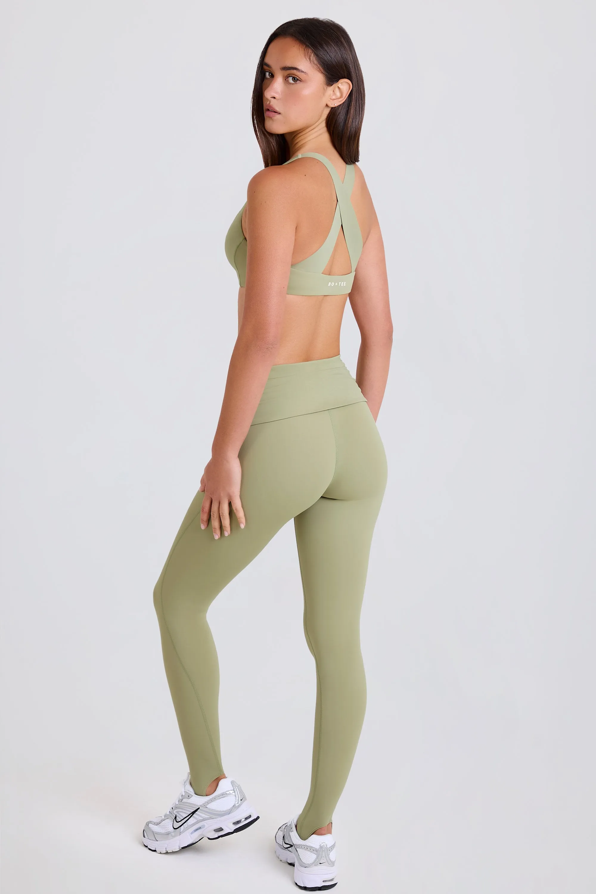 Four-Way Stretch Foldover Mid-Rise Stirrup Leggings in Matcha sold by Bo + Tee product image thumbnail 2