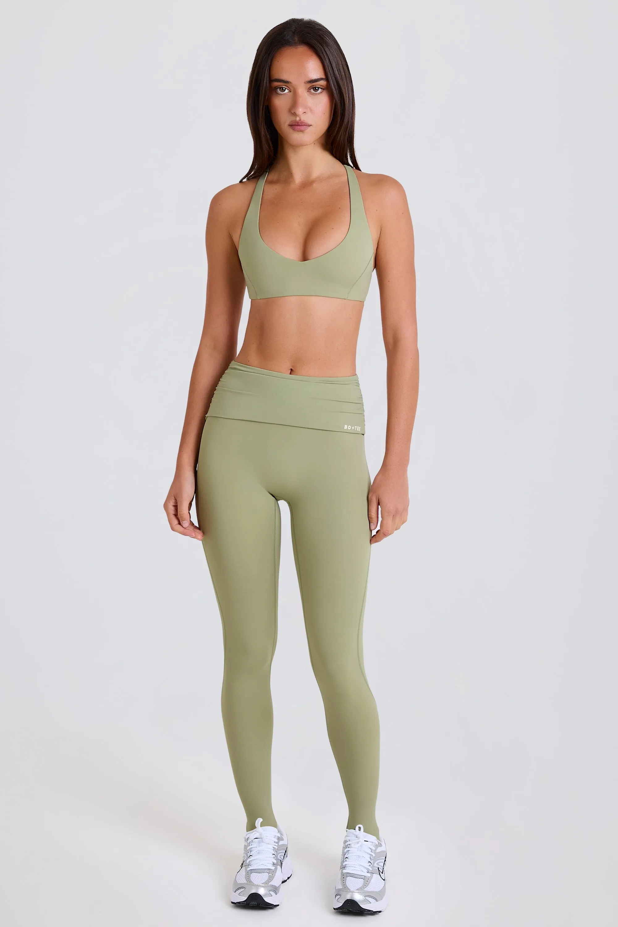 Four-Way Stretch Foldover Mid-Rise Stirrup Leggings in Matcha sold by Bo + Tee product image thumbnail 4