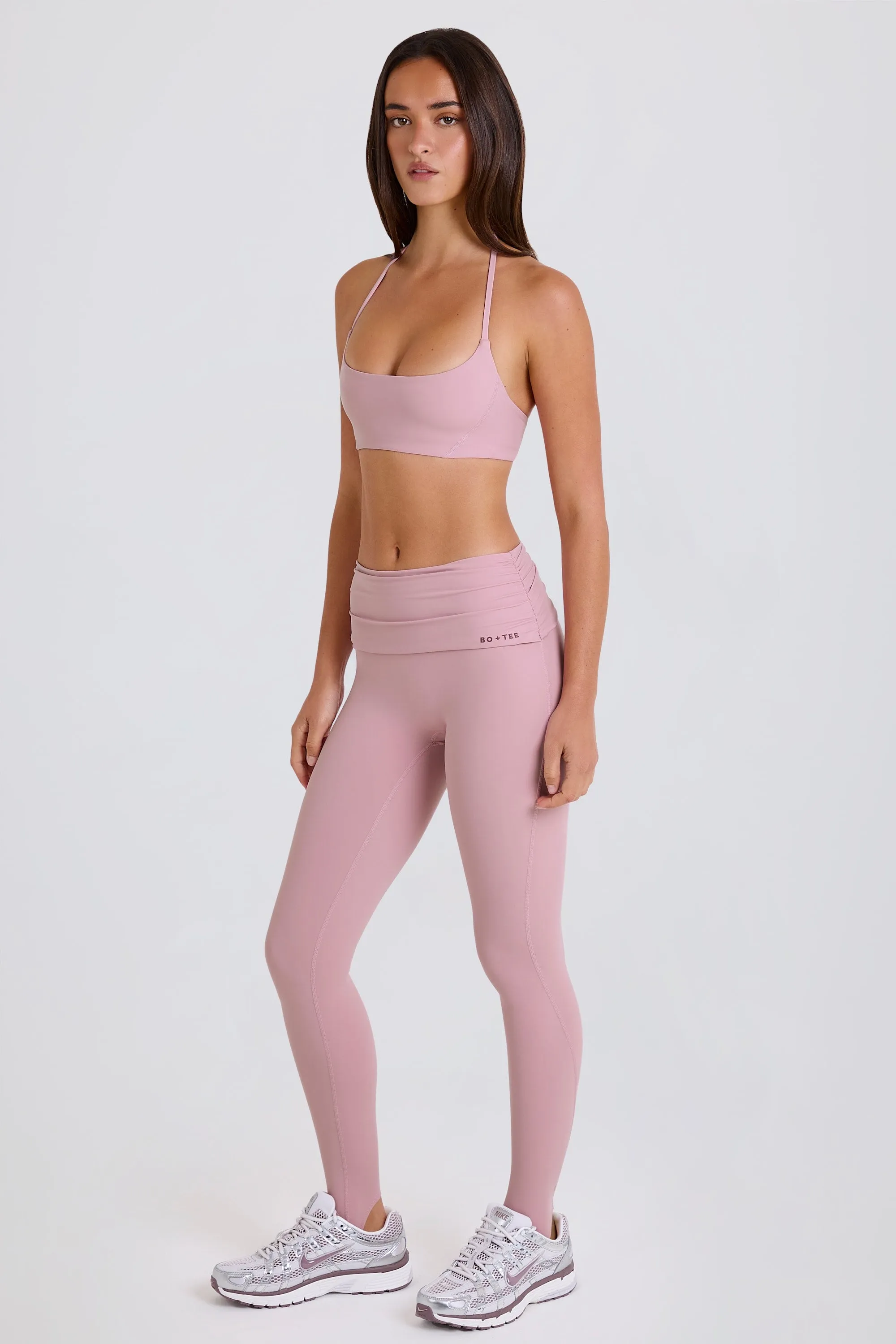 Four-Way Stretch Foldover Mid-Rise Stirrup Leggings in Mauve sold by Bo + Tee