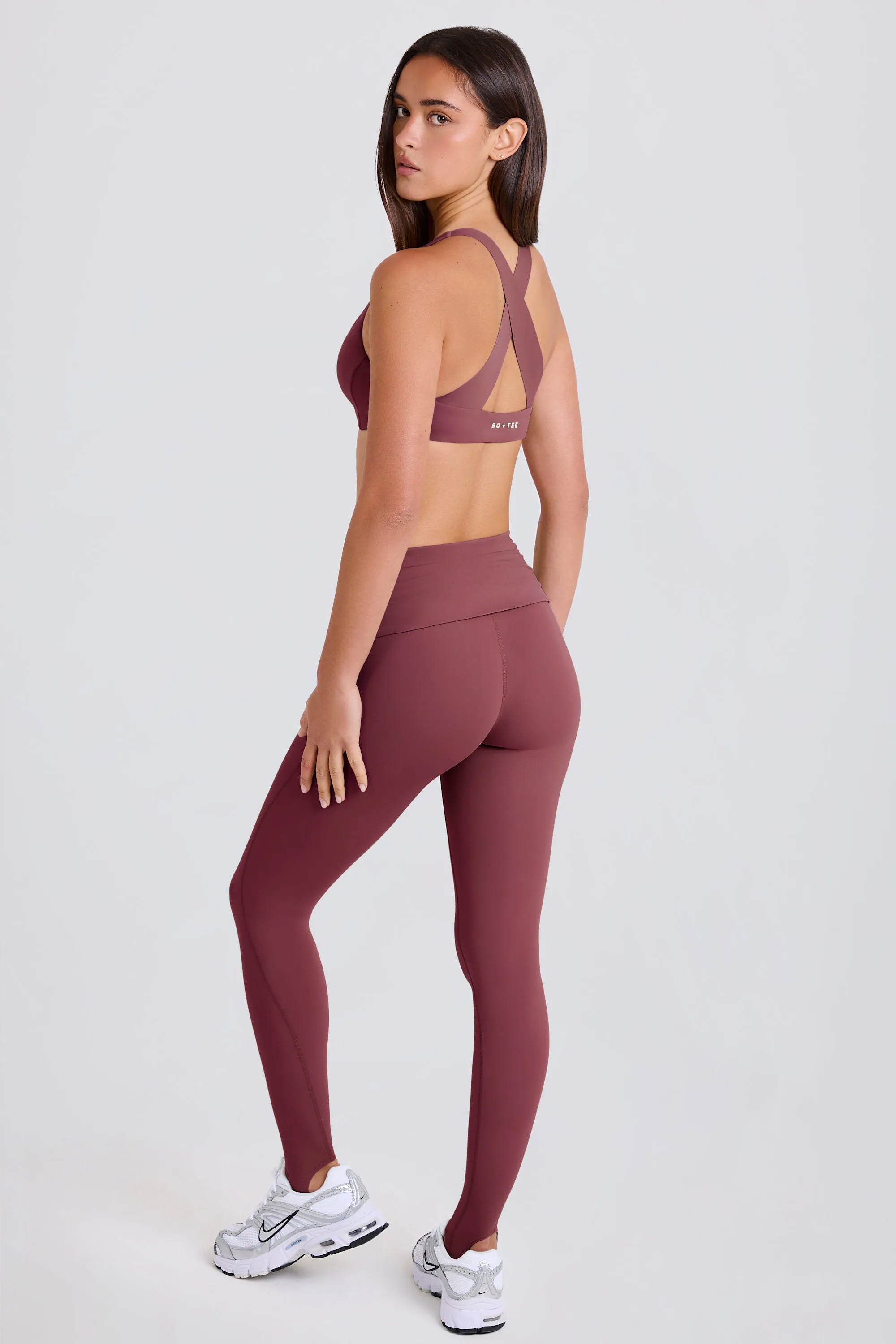 Four-Way Stretch Foldover Mid-Rise Stirrup Leggings in Acai sold by Bo + Tee product image thumbnail 2