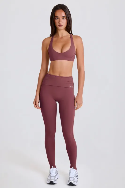 Foldover Mid-Rise Stirrup Leggings in Acai sold by Bo + Tee