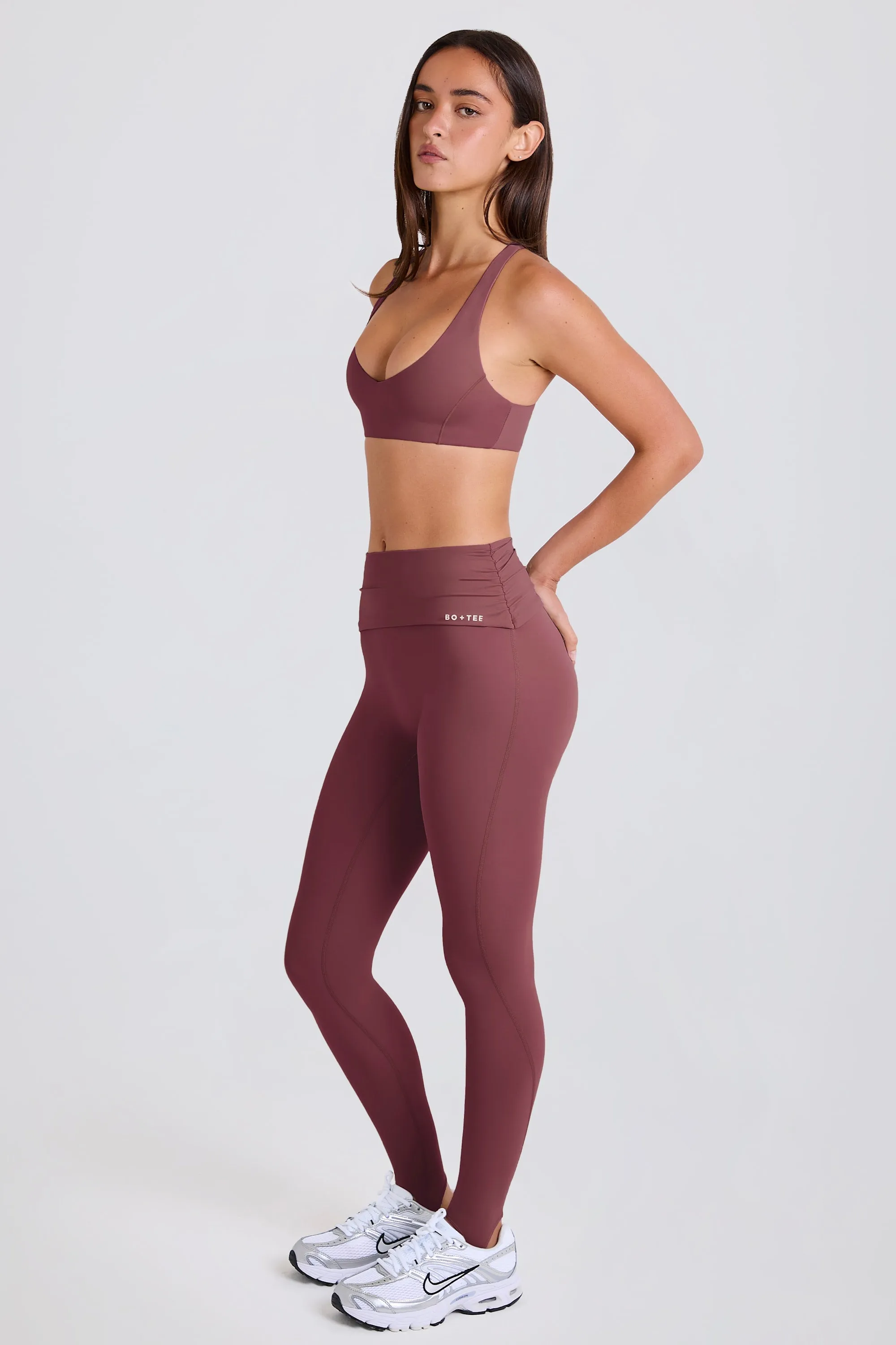 Four-Way Stretch Foldover Mid-Rise Stirrup Leggings in Acai sold by Bo + Tee product image thumbnail 5