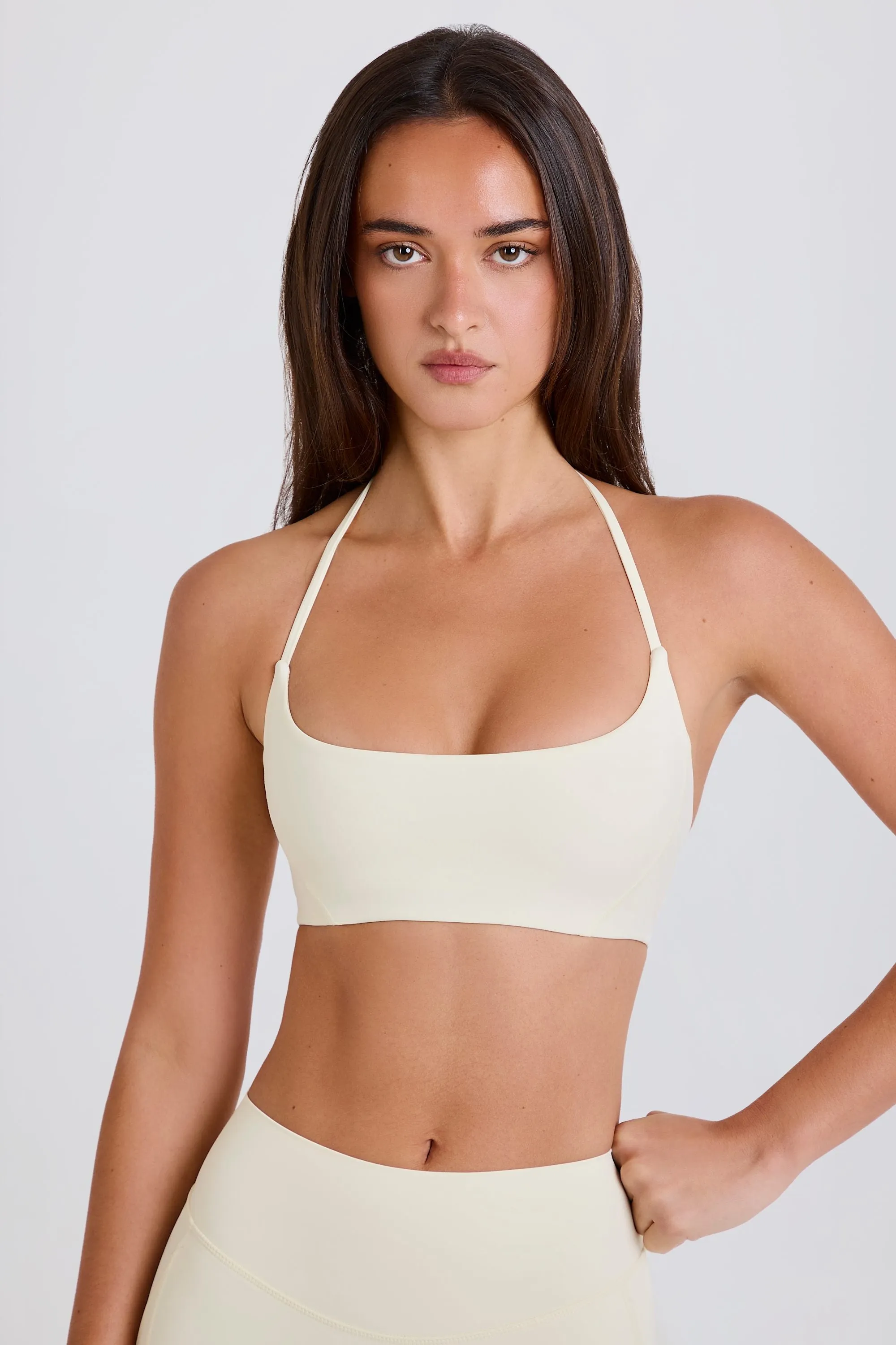 Four-Way Stretch Scoop-Neck Halterneck Sports Bra in Cream sold by Bo + Tee