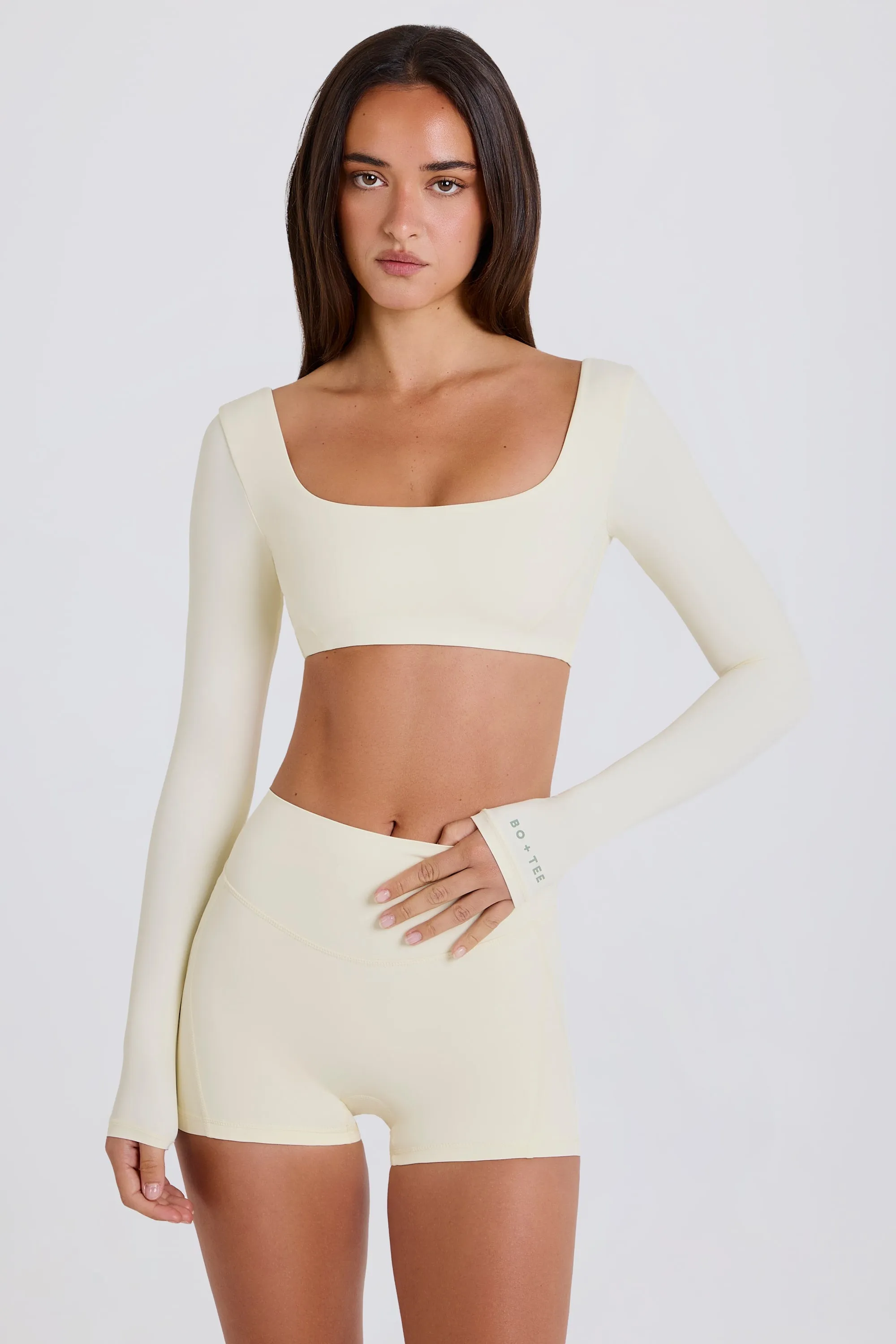 Four-Way Stretch Multiway Long-Sleeve Crop Top in Cream sold by Bo + Tee