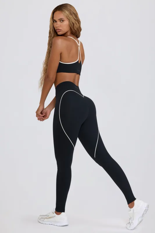 Soft Active Mid-Rise Leggings in Black sold by Bo + Tee