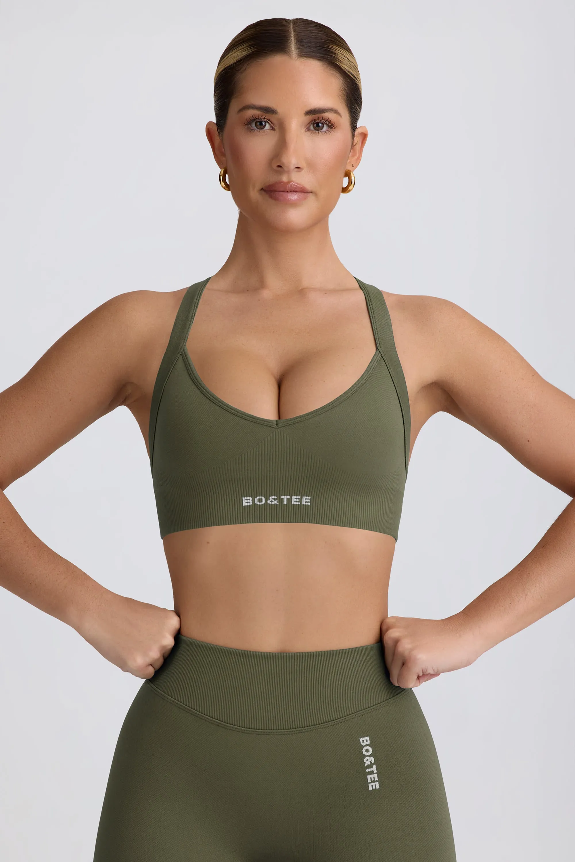 Super Sculpt Seamless Cross-Back Sports Bra in Light Green sold by Bo + Tee