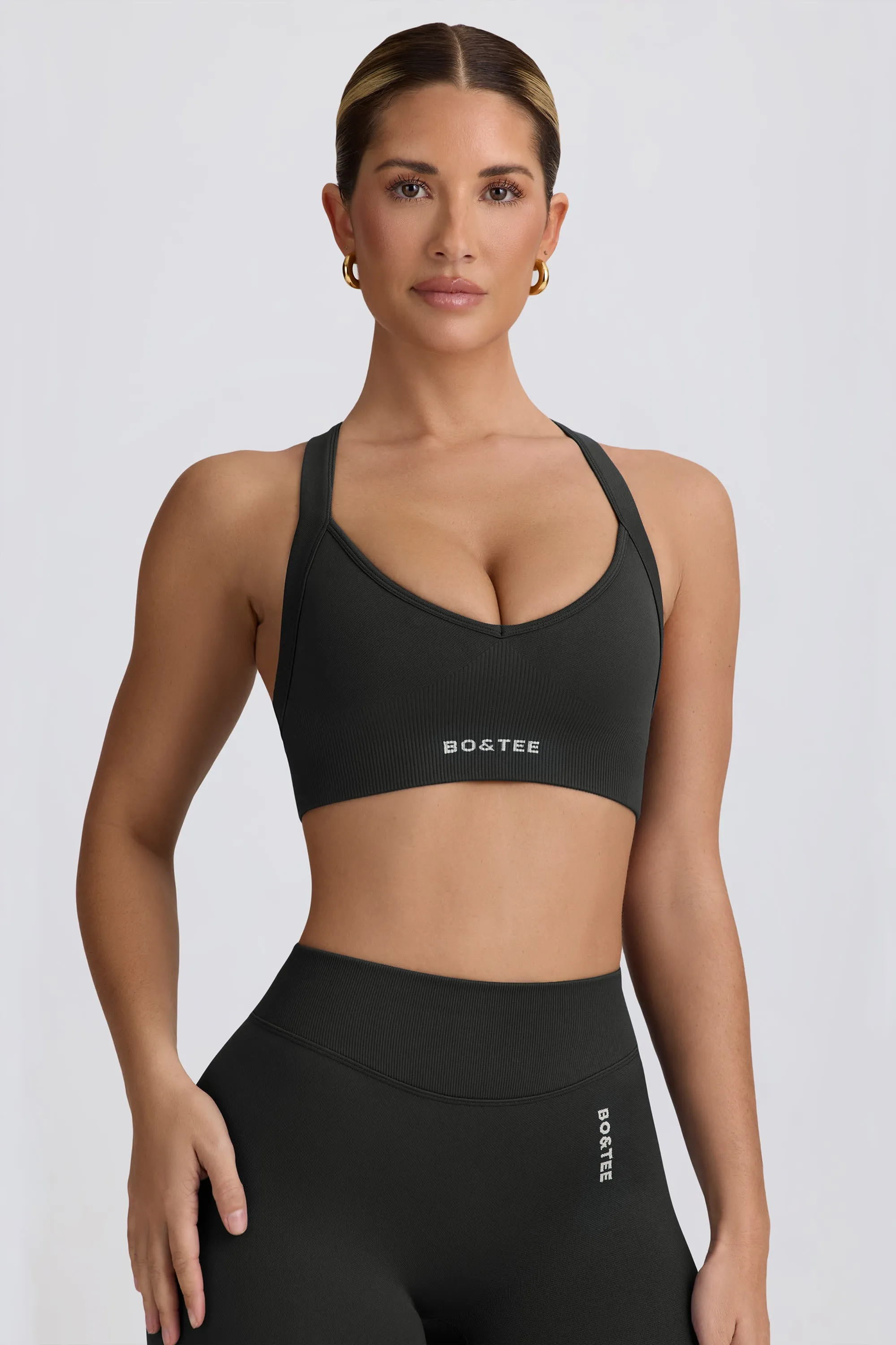 Super Sculpt Seamless Cross-Back Sports Bra in Ash sold by Bo + Tee